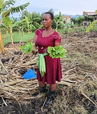 Household member recieving seedilings offere by TIFOSE